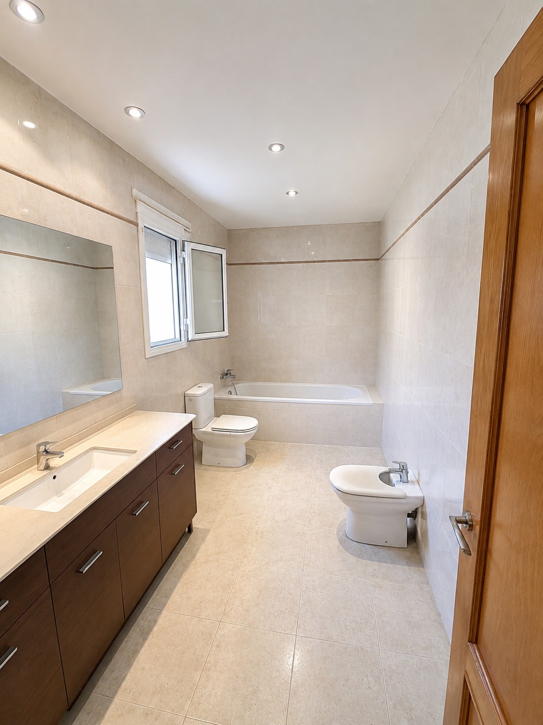 Bathroom with bathtub and double vanity