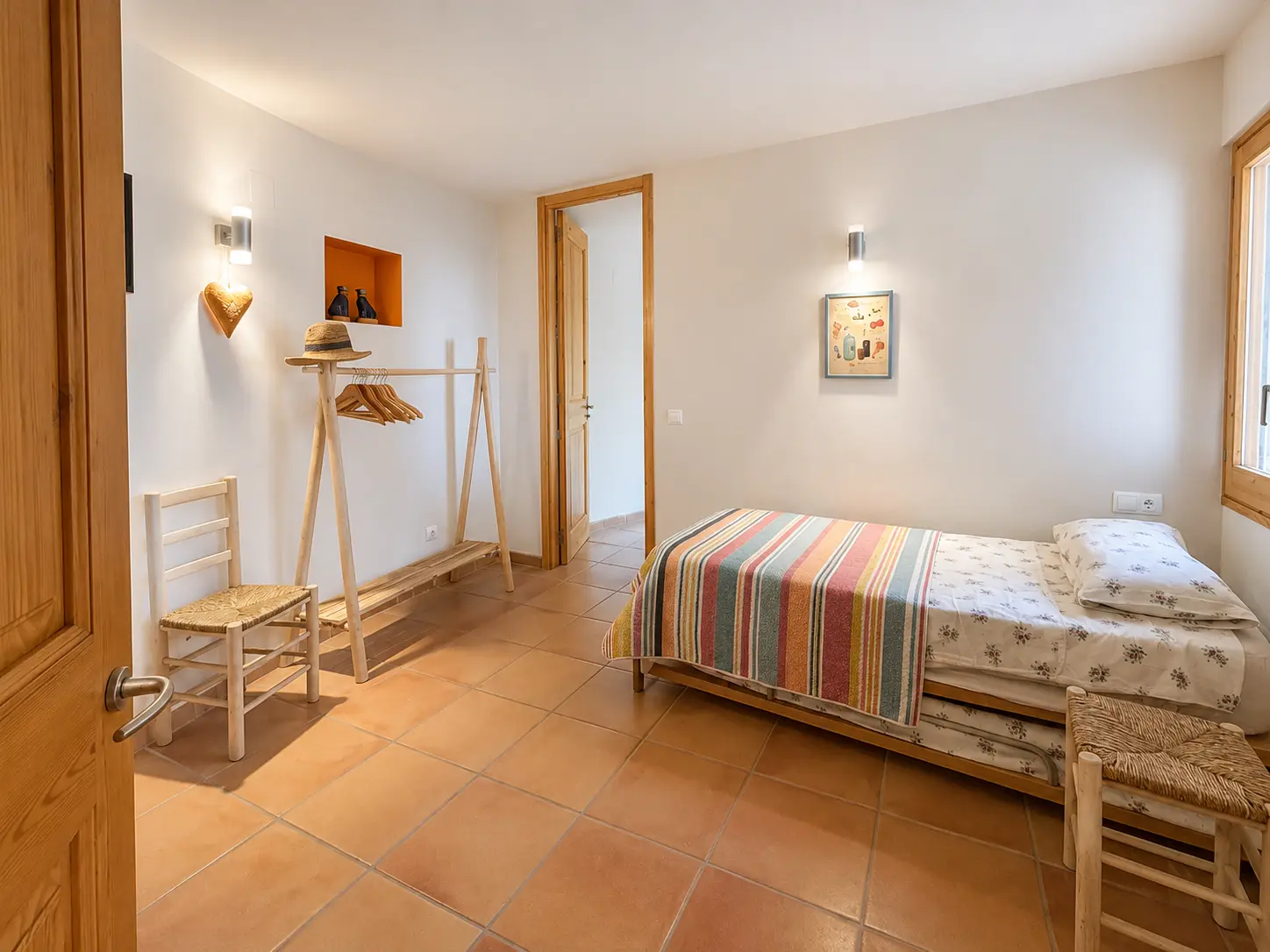 Guest bedroom with terracotta floor